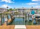Well-maintained dock featuring a boat lift, utilities, and waterfront views, ideal for boaters at 5260 Coquina Key Se Dr # C, St Petersburg, FL 33705