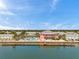 Beautiful aerial view of clubhouse with pool and pier near waterfront condos at 5260 Coquina Key Se Dr # C, St Petersburg, FL 33705