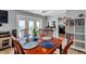 Warm dining area with bright windows offers a kitchen view and seamless indoor-outdoor living at 5260 Coquina Key Se Dr # C, St Petersburg, FL 33705