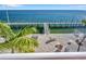 Waterfront patio area with a long wooden dock perfect for enjoying the ocean view at 5260 Coquina Key Se Dr # C, St Petersburg, FL 33705