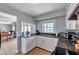 Functional kitchen with modern appliances, dark countertops, and scenic views, combining efficiency with aesthetic appeal at 5260 Coquina Key Se Dr # C, St Petersburg, FL 33705