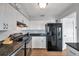 Modern kitchen with stainless steel appliances, ample counter space, and sleek black accents for a contemporary cooking experience at 5260 Coquina Key Se Dr # C, St Petersburg, FL 33705