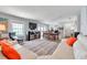 Open living and dining area with ample natural light, complemented by comfortable seating and scenic ocean views at 5260 Coquina Key Se Dr # C, St Petersburg, FL 33705