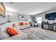 Inviting living room featuring a white sofa, stylish rug, and large-screen TV, perfect for relaxation and entertainment at 5260 Coquina Key Se Dr # C, St Petersburg, FL 33705
