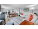 Spacious living area seamlessly blends with a dining space, creating an ideal setting for Gathering gatherings and entertaining at 5260 Coquina Key Se Dr # C, St Petersburg, FL 33705