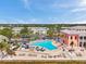 Relaxing pool area with lounge chairs, spa, and lush landscaping near waterfront condos at 5260 Coquina Key Se Dr # C, St Petersburg, FL 33705