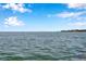 Expansive water view on a sunny day with a visible bridge in the distance at 5260 Coquina Key Se Dr # C, St Petersburg, FL 33705