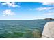 Peaceful water view featuring a concrete wall with a lovely pebble border at 5260 Coquina Key Se Dr # C, St Petersburg, FL 33705