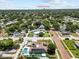 An aerial view of a home featuring a pool, playground, boat, and solar panels, with Downtown St Pete in the distance at 5401 3Rd N Ave, St Petersburg, FL 33710