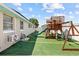 Great backyard with artificial turf and playground provides a fun, safe space for outdoor activities at 5401 3Rd N Ave, St Petersburg, FL 33710