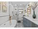 Bathroom with modern fixtures including double sinks, a walk-in shower, and a free-standing tub at 5401 3Rd N Ave, St Petersburg, FL 33710