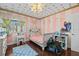 Bedroom with pink and white stripped walls, hardwood floors, and a light-colored furniture set at 5401 3Rd N Ave, St Petersburg, FL 33710