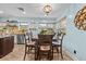 Dining nook features wood table and chairs, decor shelving, and windows that provide natural lighting at 5401 3Rd N Ave, St Petersburg, FL 33710