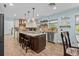Well-appointed kitchen featuring a large island, stainless steel appliances, and stylish pendant lighting at 5401 3Rd N Ave, St Petersburg, FL 33710
