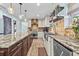 Gourmet kitchen with a large island, stainless steel appliances, and open shelving for storage and decor at 5401 3Rd N Ave, St Petersburg, FL 33710