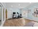 Comfortable living room featuring wood-look floors, recessed lights, and a decorative front door at 5401 3Rd N Ave, St Petersburg, FL 33710