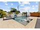 Relaxing backyard pool with lounge chairs, spa and mature tropical landscaping offers a private outdoor oasis at 5401 3Rd N Ave, St Petersburg, FL 33710
