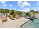 Inviting outdoor pool area with spa, lounge seating and mature tropical landscaping, ideal for relaxation and entertaining at 5401 3Rd N Ave, St Petersburg, FL 33710