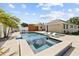 A sparkling pool with a spa and sun loungers offers a refreshing outdoor retreat at 5401 3Rd N Ave, St Petersburg, FL 33710