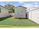 Useful backyard shed with artificial turf and perimeter striping for additional storage and activities at 5401 3Rd N Ave, St Petersburg, FL 33710