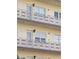 Close-up of condo balconies with aluminum railings and decorative accents, showcasing outdoor living spaces at 5705 80Th N St # 303, St Petersburg, FL 33709