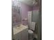 Comfortable bathroom featuring lilac walls, white fixtures, a vanity, toilet, and shower/tub at 5705 80Th N St # 303, St Petersburg, FL 33709