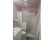 Cozy bathroom featuring lilac walls, white fixtures, a vanity, toilet, and shower/tub at 5705 80Th N St # 303, St Petersburg, FL 33709