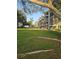 Well-maintained condominium complex with multiple floors, screened patios, and a large grassy common area at 5705 80Th N St # 303, St Petersburg, FL 33709