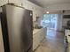 Functional kitchen with stainless steel appliances and white cabinets, providing ample storage and workspace at 5705 80Th N St # 303, St Petersburg, FL 33709