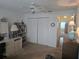 This home office features a built-in desk, ample storage, and a large closet for an organized workspace at 5705 80Th N St # 303, St Petersburg, FL 33709
