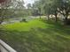 Picturesque view of a green lawn and mature trees, offering a peaceful and scenic backdrop at 5705 80Th N St # 303, St Petersburg, FL 33709
