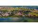 Stunning aerial view of the golf course community with water views, landscaping, and multiple buildings at 6158 Palma Del Mar S Blvd # 306, St Petersburg, FL 33715