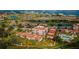 Beautiful aerial view of the community, including a golf course, swimming pool, and waterfront access at 6158 Palma Del Mar S Blvd # 306, St Petersburg, FL 33715