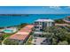 Beautiful aerial view of complex with water views and a swimming pool and patio area at 6158 Palma Del Mar S Blvd # 306, St Petersburg, FL 33715