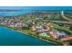 Breathtaking aerial view of a golf community situated by the bay, featuring numerous condo buildings at 6158 Palma Del Mar S Blvd # 306, St Petersburg, FL 33715