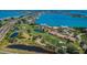 Gorgeous aerial view of bayfront community including condos, a golf course, and the ocean at 6158 Palma Del Mar S Blvd # 306, St Petersburg, FL 33715