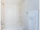 Bright bathroom featuring a shower over the tub and a towel rack at 6158 Palma Del Mar S Blvd # 306, St Petersburg, FL 33715