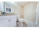 Cozy bathroom with granite countertop vanity, toilet, and shower and bath tub combination at 6158 Palma Del Mar S Blvd # 306, St Petersburg, FL 33715