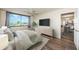 Open bedroom featuring large windows and view to living areas with view to the golf course at 6158 Palma Del Mar S Blvd # 306, St Petersburg, FL 33715