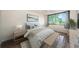 Bright bedroom featuring a large window with scenic views and a cozy seating bench at 6158 Palma Del Mar S Blvd # 306, St Petersburg, FL 33715