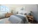 Bright bedroom features a large window with a water view, and stylish coastal decor at 6158 Palma Del Mar S Blvd # 306, St Petersburg, FL 33715