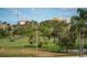 Scenic golf course view with palm trees and blue skies in the background at 6158 Palma Del Mar S Blvd # 306, St Petersburg, FL 33715