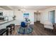 Open-concept kitchen and dining area with sleek flooring and a cozy seating arrangement at 6158 Palma Del Mar S Blvd # 306, St Petersburg, FL 33715