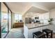 Well-lit kitchen with stainless appliances, granite counters, and access to a balcony with outdoor seating at 6158 Palma Del Mar S Blvd # 306, St Petersburg, FL 33715