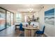 Bright kitchen featuring stainless steel appliances, granite countertops, and adjacent dining area at 6158 Palma Del Mar S Blvd # 306, St Petersburg, FL 33715