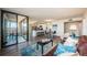 Open concept living area with a kitchen, dining area, and access to the balcony at 6158 Palma Del Mar S Blvd # 306, St Petersburg, FL 33715