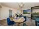 Cozy living room and dining area combination with a scenic view from the large windows at 6158 Palma Del Mar S Blvd # 306, St Petersburg, FL 33715