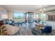 Cozy living room with hardwood floors and floor to ceiling windows at 6158 Palma Del Mar S Blvd # 306, St Petersburg, FL 33715