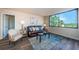 The living room has hardwood floors and a large window at 6158 Palma Del Mar S Blvd # 306, St Petersburg, FL 33715
