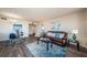 Cozy living room featuring a leather sofa, area rug, and dining area at 6158 Palma Del Mar S Blvd # 306, St Petersburg, FL 33715